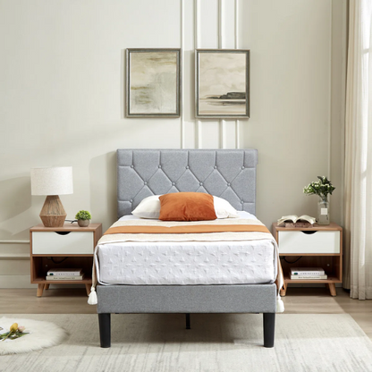 Grey upholstered twin platform bed frame with diamond-tufted linen headboard, sturdy metal construction, and center support legs, no box spring needed.

