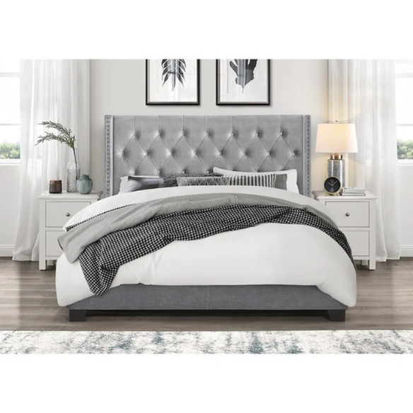 Grey velvet full size upholstered bed with button-tufted wingback headboard, nailhead trim, and solid wood frame.