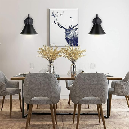 Industrial matte black swing arm wall sconce with adjustable arm and E26 bulb socket, perfect for vintage-inspired interiors.