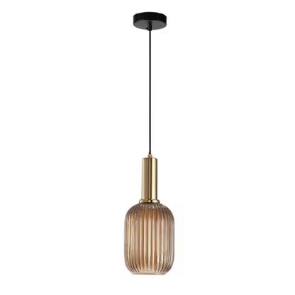 Industrial vintage pendant light with ribbed amber glass and brass finish for modern home decor.