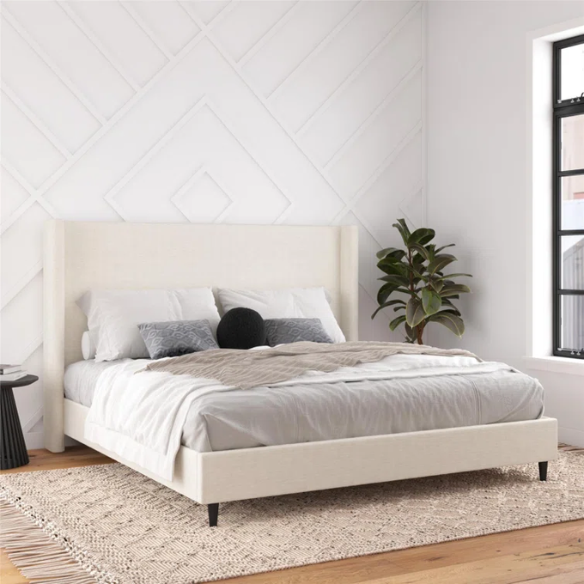 Ivory bouclé upholstered king-size platform bed with tall wingback headboard, wood slats, and no box spring required.

