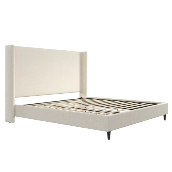 Ivory bouclé upholstered king-size platform bed with tall wingback headboard, wood slats, and no box spring required.

