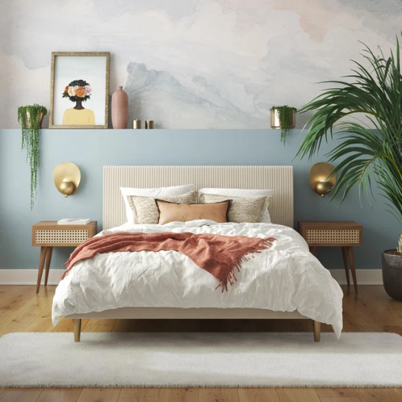 Ivory velvet king-size platform bed with upholstered headboard and footboard, no box spring required.

