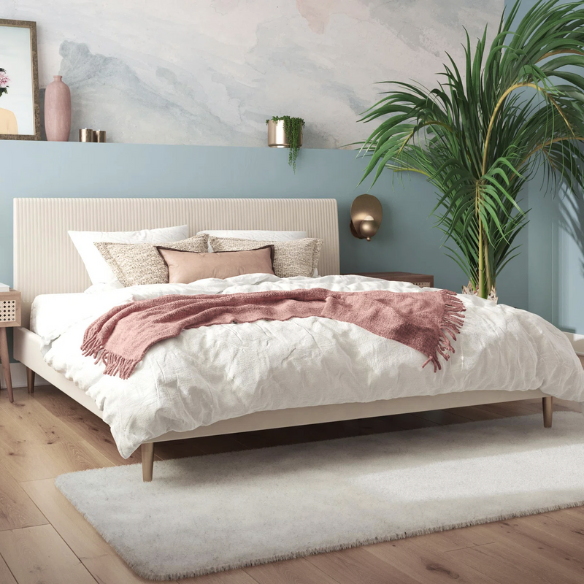 Ivory velvet king-size platform bed with upholstered headboard and footboard, no box spring required.

