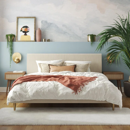 Ivory velvet king-size platform bed with upholstered headboard and footboard, no box spring required.

