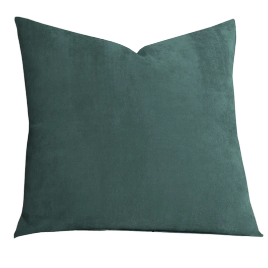 Juniper green crushed velvet throw pillow, 16x16 square with soft, reversible fabric and hidden zipper, styled on a cozy sofa for a sophisticated touch.

