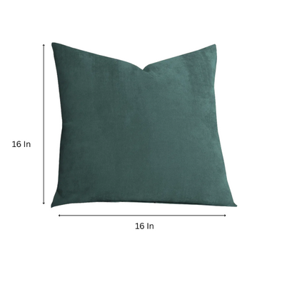 Juniper green crushed velvet throw pillow, 16x16 square with soft, reversible fabric and hidden zipper, styled on a cozy sofa for a sophisticated touch.

