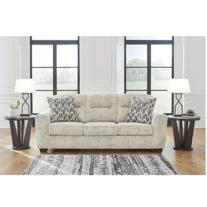 Light beige 3-seater sofa with plush cushions, accent pillows, and dark tri-block legs, ideal for modern living rooms.

