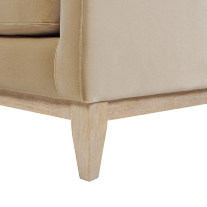 Light camel velvet 3-seater sofa with feather-down cushions, track arms, and solid wood legs, ideal for modern and transitional spaces.

