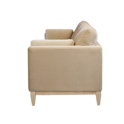 Light camel velvet 3-seater sofa with feather-down cushions, track arms, and solid wood legs, ideal for modern and transitional spaces.

