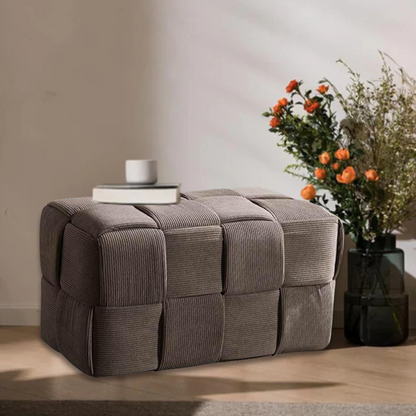 Light chocolate brown velvet ottoman with modern design and resilient sponge filling, perfect for living room or bedroom.