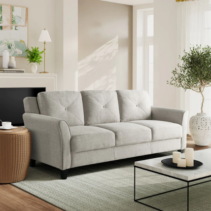 Modern 3-seater sofa upholstered in light grey microfiber with tufted back cushions, flared arms, and a durable eucalyptus wood frame – ideal for contemporary and transitional living rooms

