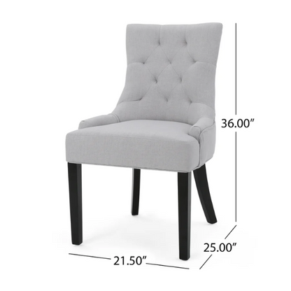 Set of four light grey upholstered dining chairs with diamond tufted backs, armless design, sloped armrests, and espresso brown wood legs.

