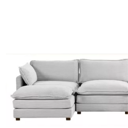 Light grey modular 4-seat sectional sofa with two matching ottomans, upholstered in soft corduroy fabric with high-resilience cushions and a durable wood and metal frame.