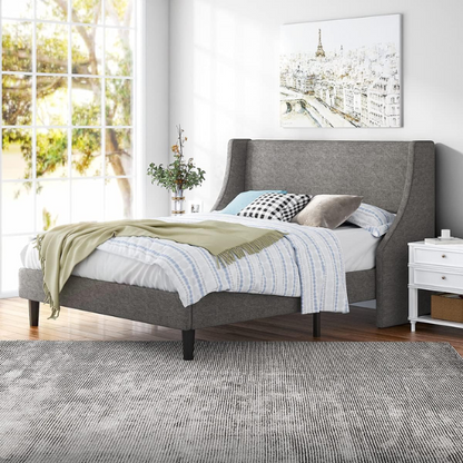 Light grey linen upholstered queen platform bed with wingback headboard, tapered black legs, and slatted support – no box spring needed

