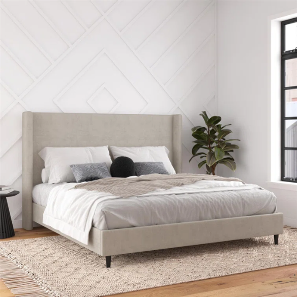 Light grey upholstered king platform bed with tall wingback headboard in soft woven fabric, no box spring required
