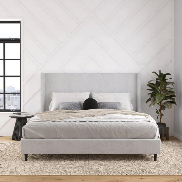 Light grey upholstered king platform bed with tall wingback headboard in soft woven fabric, no box spring required