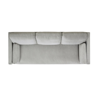 Light grey velvet 3-seater sofa with feather-down cushions, track arms, and natural wood legs, designed for modern and transitional spaces.

