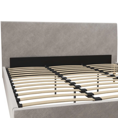 Light grey velvet king-size platform bed with upholstered headboard and wood slats, modern design, no box spring required.

