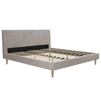 Light grey velvet king-size platform bed with upholstered headboard and wood slats, modern design, no box spring required.

