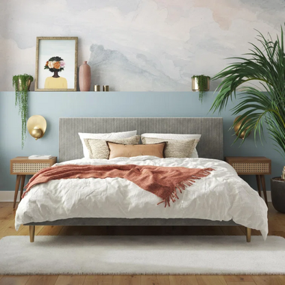 Light grey velvet king-size platform bed with upholstered headboard and wood slats, modern design, no box spring required.


