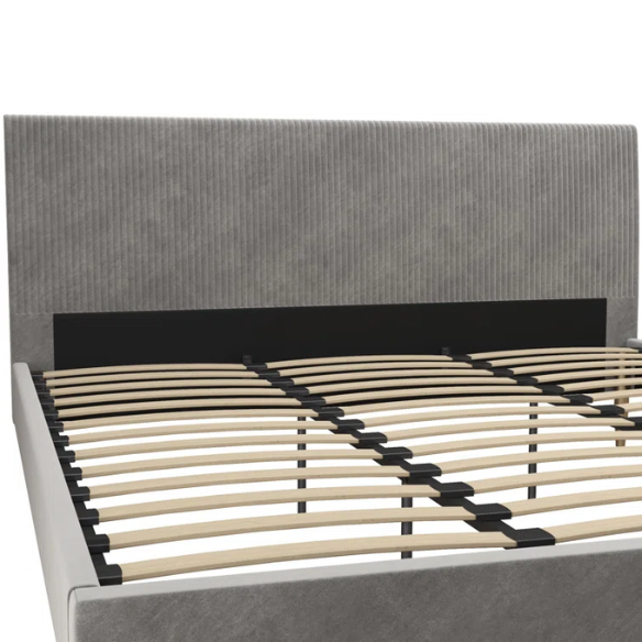 Light grey velvet king-size platform bed with upholstered headboard and wood slats, modern design, no box spring required.

