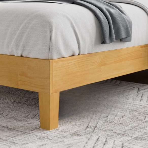 Light natural wood queen platform bed with slatted base and rectangular headboard, made from solid pine with metal center support legs