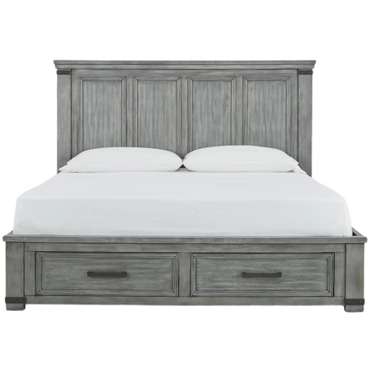 King-size storage bed in light weathered gray finish with tall panel headboard, footboard drawers, and dark bronze hardware accents

