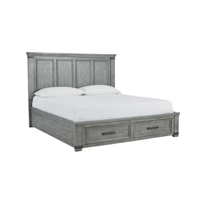King-size storage bed in light weathered gray finish with tall panel headboard, footboard drawers, and dark bronze hardware accents

