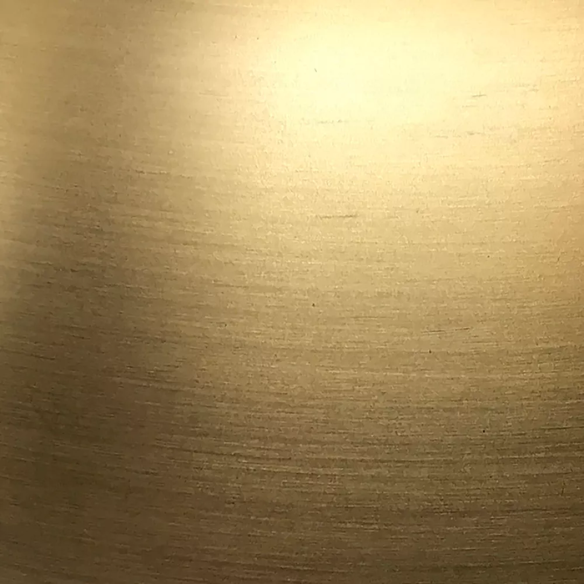 Mid-century modern brass table lamp with a white drum fabric shade and rotary switch, ideal for living rooms, bedrooms, or office desks

