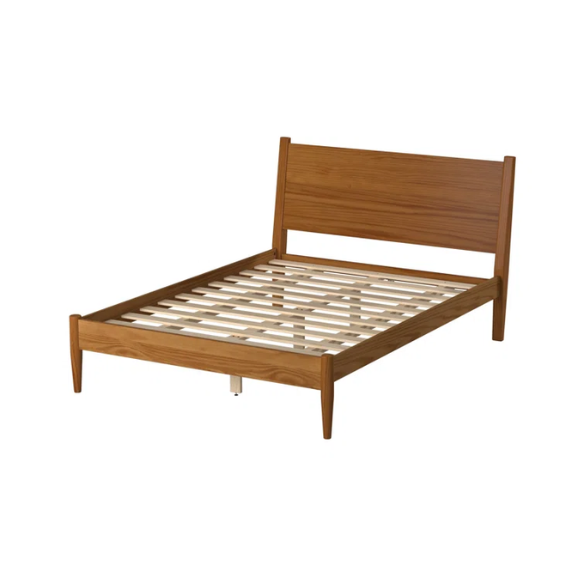 Mid-century modern full-size solid wood platform bed in medium light brown with rectangular headboard and tapered legs