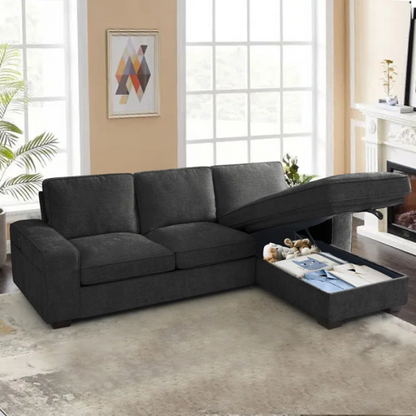 Modern black chenille upholstered sofa with reversible cushions, built-in USB charging port, under-seat storage, and matching ottoman and toss pillows.


