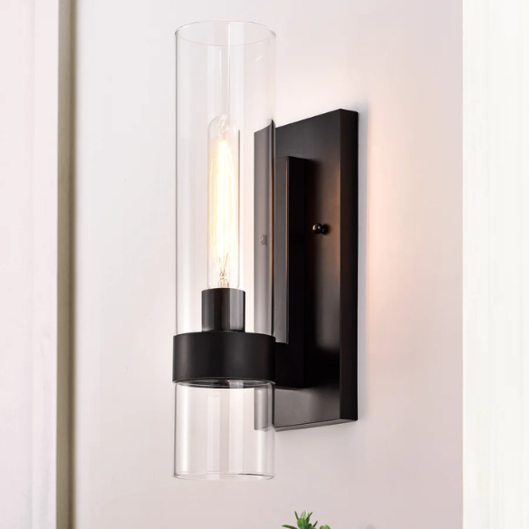 Modern black wall sconce with cylindrical clear glass shade – contemporary uplight fixture for bathrooms, hallways, or bedrooms

