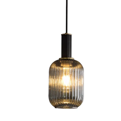 Modern black glass pendant light with frosted smoke gray shade and brass finish for contemporary home decor.