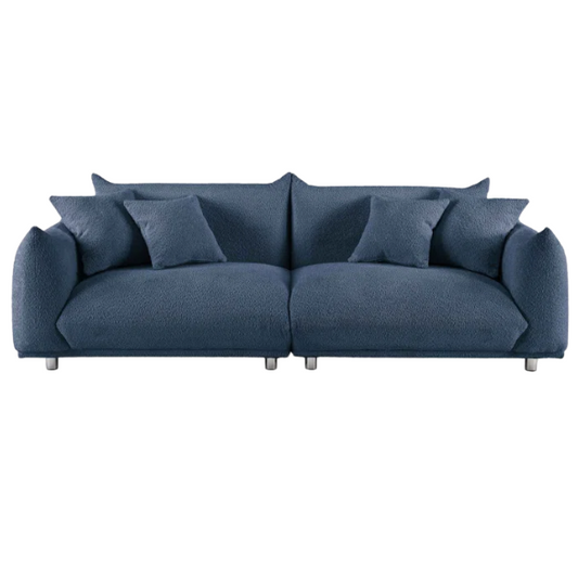 Modern blue upholstered sofa with deep seating and chrome-finished legs, featuring 4 matching accent pillows for a clean, contemporary living room look.