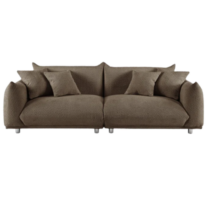 Modern camel upholstered sofa with deep seating and chrome-finished legs, featuring 4 matching accent pillows, ideal for stylish living rooms.