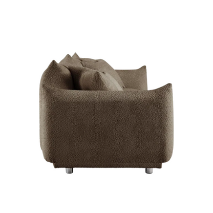 Modern camel upholstered sofa with deep seating and chrome-finished legs, featuring 4 matching accent pillows, ideal for stylish living rooms.