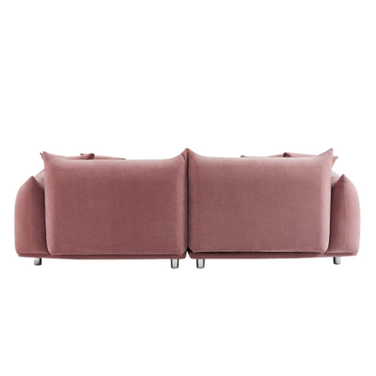 Modern dusty rose upholstered sofa with deep seating and chrome-finished legs, featuring four matching accent pillows—ideal for soft, stylish living spaces.