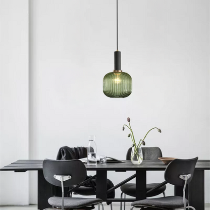 Modern green glass pendant light with black finishes, ideal for kitchen island, dining room, and living spaces. Stylish ceiling fixture with adjustable cord, energy-efficient LED compatible, and UL listed.