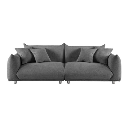 Modern 88.9-inch grey upholstered sofa with deep seat, rounded arms, chrome legs, and four matching accent pillows – ideal for contemporary living rooms or apartments.

