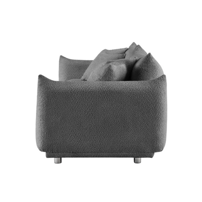 Modern 88.9-inch grey upholstered sofa with deep seat, rounded arms, chrome legs, and four matching accent pillows – ideal for contemporary living rooms or apartments.

