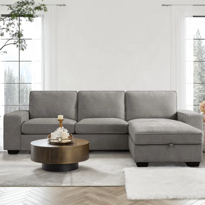 Modern light grey chenille upholstered sofa with reversible cushions, under-seat storage, built-in USB charging port, and matching ottoman and accent pillows.

