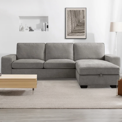 Modern light grey chenille upholstered sofa with reversible cushions, under-seat storage, built-in USB charging port, and matching ottoman and accent pillows.

