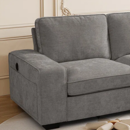 Modern light grey chenille upholstered sofa with reversible cushions, under-seat storage, built-in USB charging port, and matching ottoman and accent pillows.

