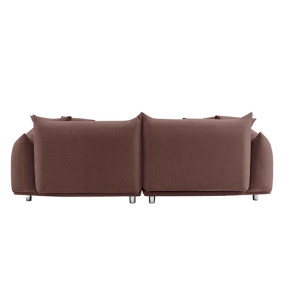Modern muted brown upholstered sofa with deep seating and chrome-finished legs, featuring four matching accent pillows—ideal for warm, modern interiors.