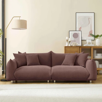 Modern muted brown upholstered sofa with deep seating and chrome-finished legs, featuring four matching accent pillows—ideal for warm, modern interiors.