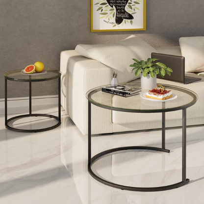 Modern round nesting coffee tables with black glass top and black metal legs