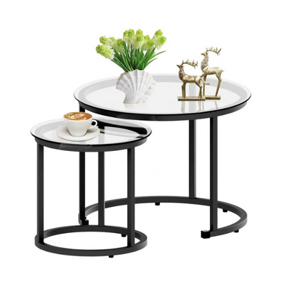 Modern round nesting coffee tables with black glass top and black metal legs