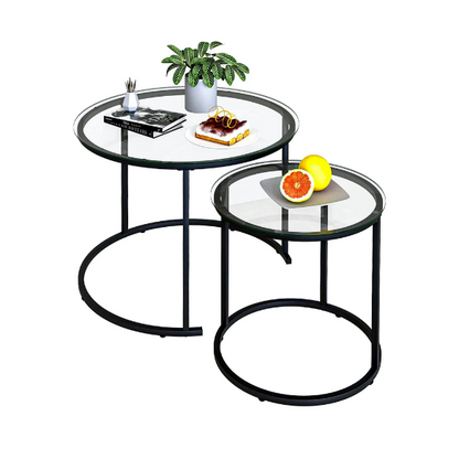 Modern round nesting coffee tables with black glass top and black metal legs