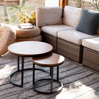 Modern round nesting coffee tables with brown wood top and black metal legs